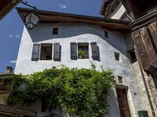 Discover the charm of this historic property, featuring a unique architectural design with traditional shutters and windows.