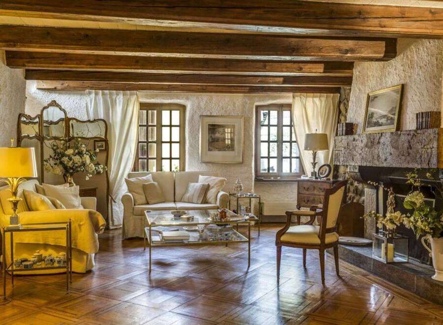 Step into a world of rustic elegance with this stunning property, showcasing a cozy living room.