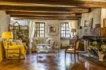 Step into a world of rustic elegance with this stunning property, showcasing a cozy living room.