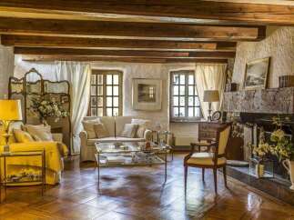 Step into a world of rustic elegance with this stunning property, showcasing a cozy living room.