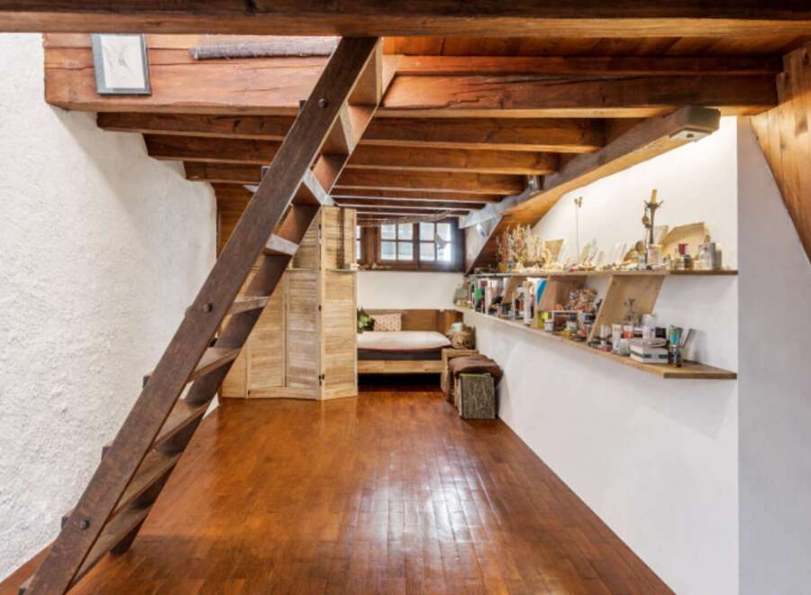 Discover the charm of this unique property featuring exposed wooden beams and a cozy loft space.