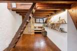 Discover the charm of this unique property featuring exposed wooden beams and a cozy loft space.