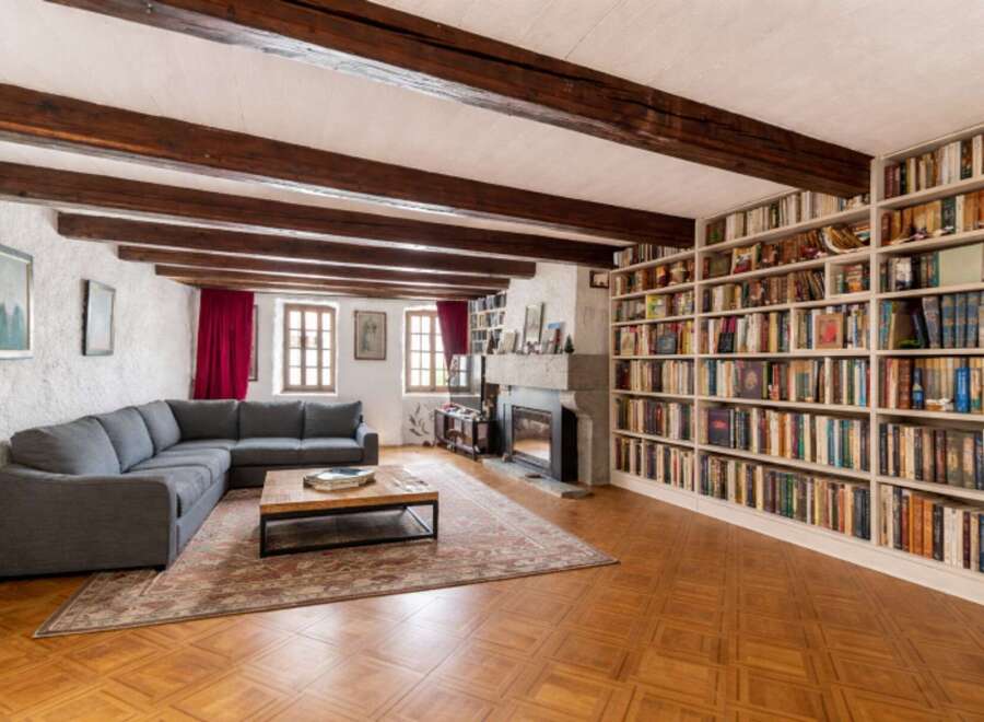 Step into this inviting living room featuring a spacious sectional sofa perfect for relaxation and entertainment.