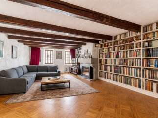 Step into this inviting living room featuring a spacious sectional sofa perfect for relaxation and entertainment.