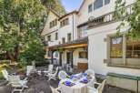 Discover the charm of this stunning property, featuring a beautifully designed outdoor dining area perfect for entertaining.