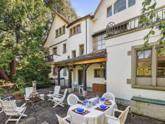 Discover the charm of this stunning property, featuring a beautifully designed outdoor dining area perfect for entertaining.