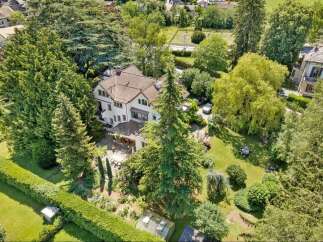 Discover this stunning property nestled in a serene, tree-filled setting.