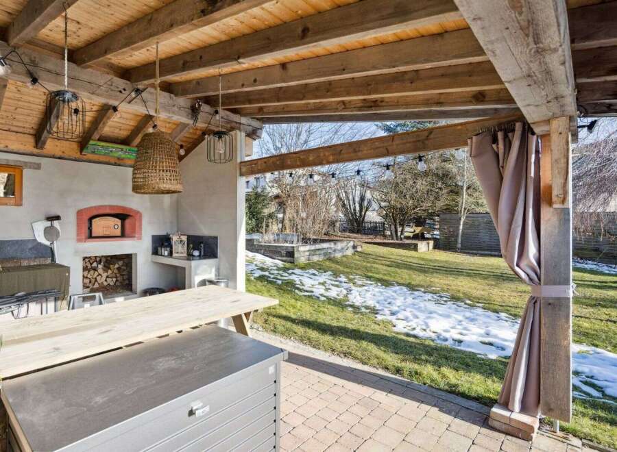 Enjoy outdoor living at its finest with this stunning property featuring a covered patio.