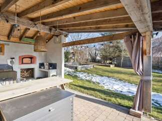 Enjoy outdoor living at its finest with this stunning property featuring a covered patio.