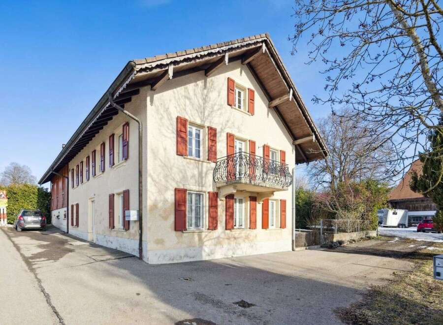This charming property boasts a classic design with a warm, inviting facade.