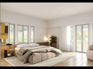 Experience luxury living in this stunning bedroom, featuring a modern design and breathtaking views.