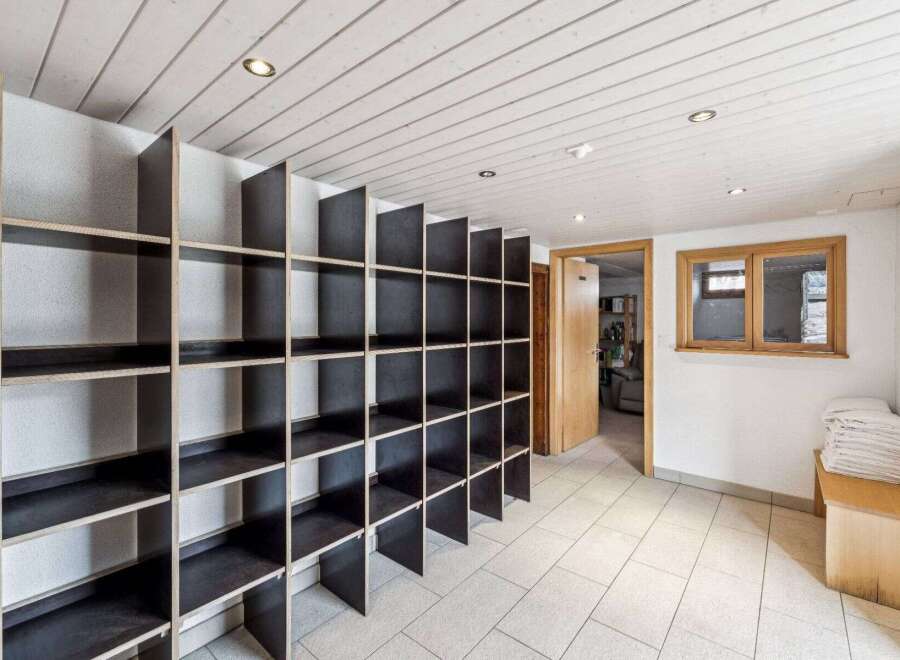 Discover the potential of this versatile space! This property boasts a unique storage solution with built-in shelving, perfect for organization.