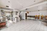 This spacious property features a well-equipped commercial kitchen, perfect for culinary ventures.