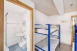 Discover this charming property featuring a cozy bunk bed setup, perfect for accommodating guests or family.