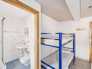 Discover this charming property featuring a cozy bunk bed setup, perfect for accommodating guests or family.