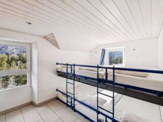 Discover the charm of this cozy bunk room, perfect for accommodating guests or family.