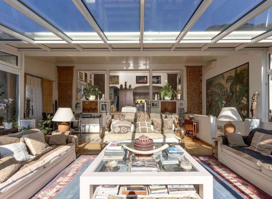 Step into a sun-drenched sanctuary with this stunning property, boasting a breathtaking glass ceiling that floods the space with natural light.