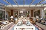 Step into a sun-drenched sanctuary with this stunning property, boasting a breathtaking glass ceiling that floods the space with natural light.