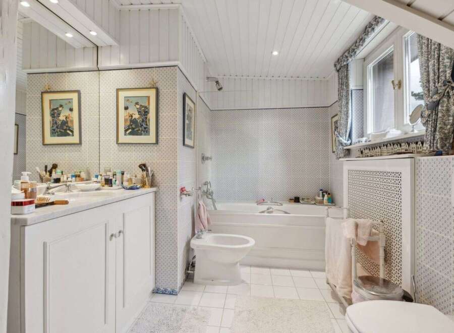 Step into a serene bathroom retreat, featuring a classic design with a touch of elegance.