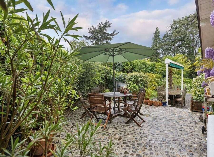 Enjoy outdoor living at its finest with this charming patio space.