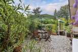 Enjoy outdoor living at its finest with this charming patio space.