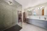 Step into luxury with this stunning bathroom featuring a sleek, modern design.