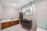 Step into luxury with this stunning bathroom! Featuring a sleek, modern vanity with ample storage, and a relaxing bathtub, this space is designed for ultimate comfort.