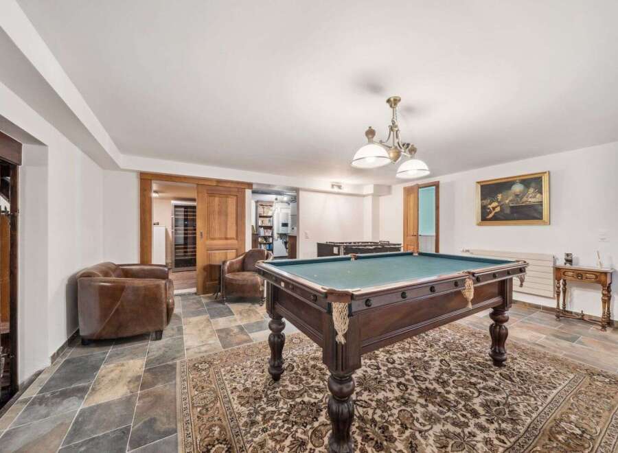 Step into luxury with this stunning property featuring a dedicated game room.