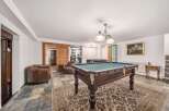 Step into luxury with this stunning property featuring a dedicated game room.
