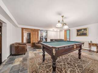 Step into luxury with this stunning property featuring a dedicated game room.