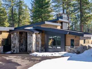 This stunning modern home seamlessly blends with its natural surroundings.