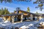 This stunning modern home boasts a unique architectural design with a blend of natural materials.