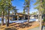 This stunning modern home boasts a unique architectural design with a blend of natural materials.