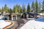This stunning modern home boasts a sleek design with a blend of natural elements.