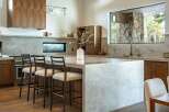 This stunning kitchen boasts a modern design with high-end finishes.