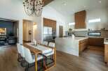 This stunning kitchen and dining area boasts a modern design with high-end finishes.