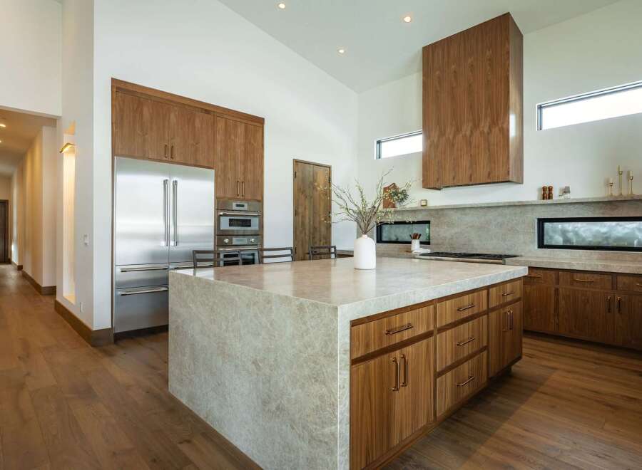 This stunning kitchen boasts a modern design with high-end finishes.