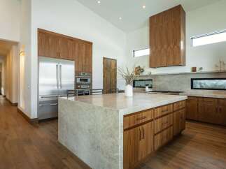 This stunning kitchen boasts a modern design with high-end finishes.