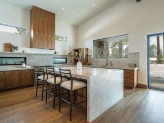 This stunning kitchen boasts a modern design with high-end finishes.