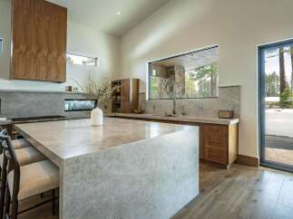 This stunning kitchen boasts a modern design with high-end finishes.