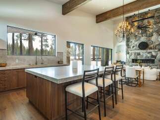 Experience luxury living in this stunning property featuring a gourmet kitchen with a spacious island and modern appliances.