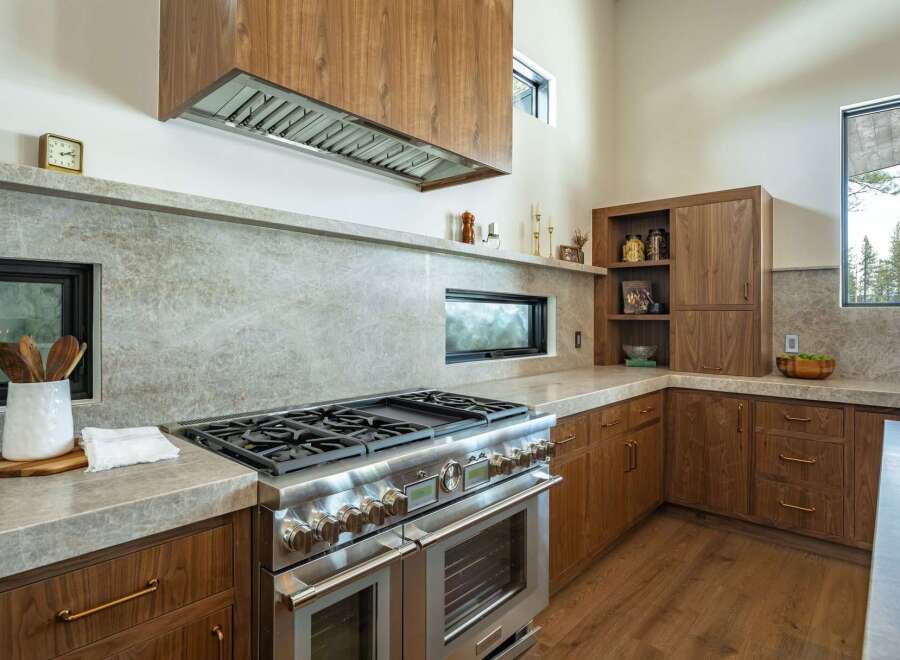 This stunning kitchen boasts high-end appliances and custom cabinetry, perfect for the discerning homeowner.