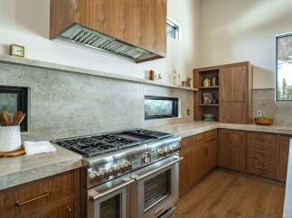 This stunning kitchen boasts high-end appliances and custom cabinetry, perfect for the discerning homeowner.