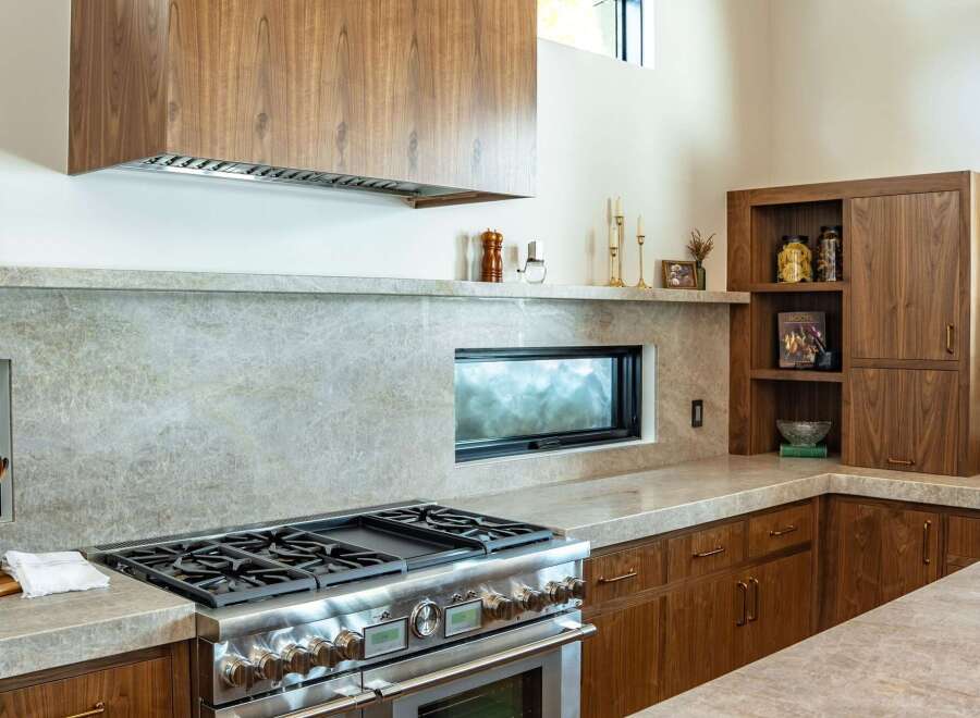 This stunning kitchen boasts a modern design with high-end appliances and custom cabinetry.
