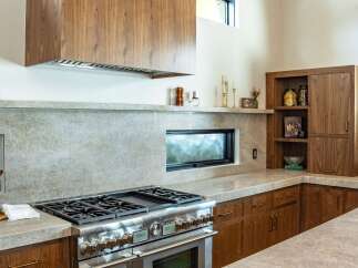 This stunning kitchen boasts a modern design with high-end appliances and custom cabinetry.