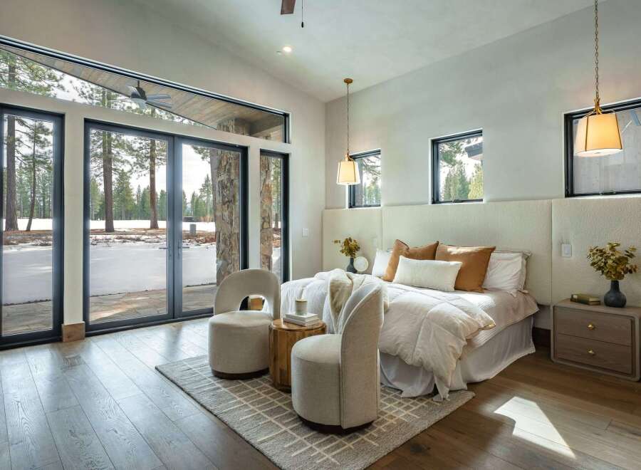 This stunning bedroom boasts a seamless blend of modern design and natural beauty.