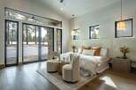 This stunning bedroom boasts a seamless blend of modern design and natural beauty.