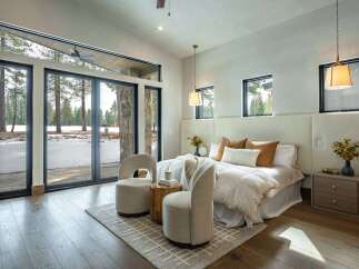 This stunning bedroom boasts a seamless blend of modern design and natural beauty.