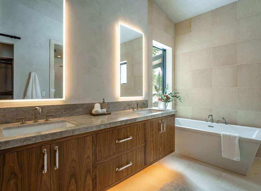 Step into luxury with this stunning bathroom featuring a sleek, modern design.