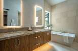 Step into luxury with this stunning bathroom featuring a sleek, modern design.